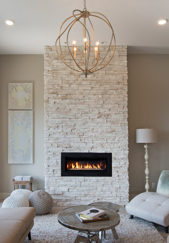 Contemporary living room in Vancouver with a stone fireplace surround.