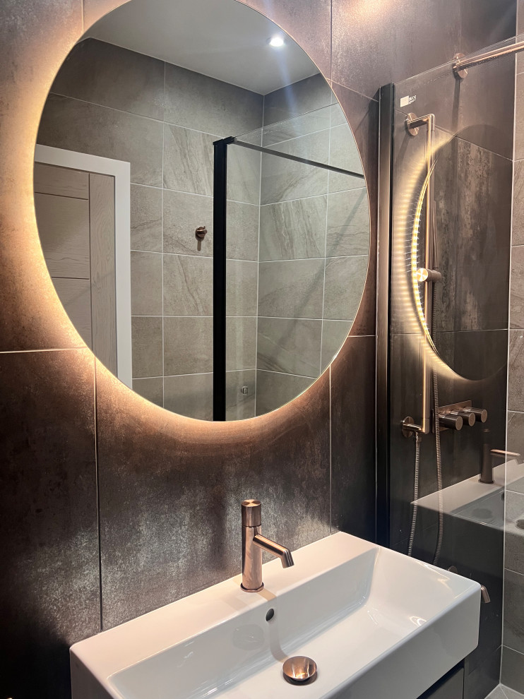 Design ideas for a mid-sized contemporary 3/4 wet room bathroom with flat-panel cabinets, beige cabinets, a wall-mount toilet, porcelain tile, brown walls, porcelain floors, a drop-in sink, beige floor, an open shower, a single vanity and a floating vanity.