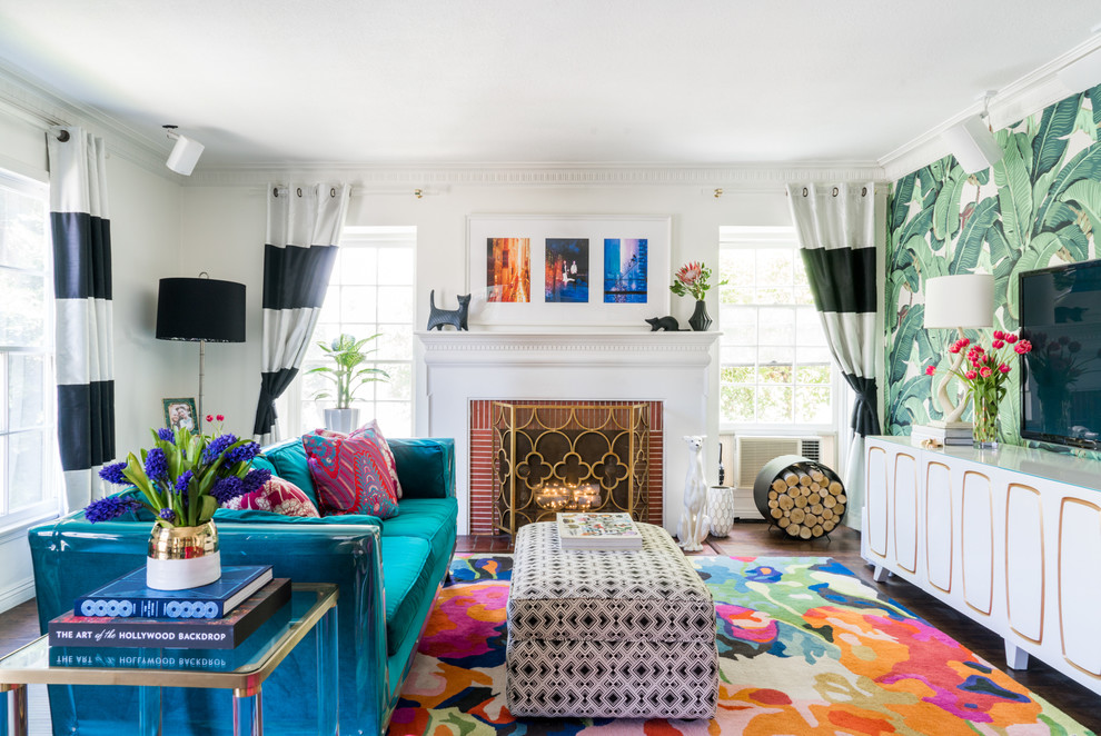 Inspiration for a mid-sized eclectic family room in Los Angeles with multi-coloured walls, vinyl floors, a standard fireplace, a brick fireplace surround and a wall-mounted tv.