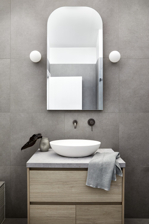 Small Bathroom Backsplash with Wooden Vanity and Wall-Mounted Plumbing Fixtures