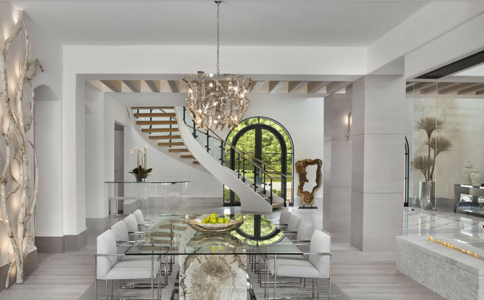 Large transitional open plan dining in Miami with white walls, light hardwood floors, no fireplace and beige floor.
