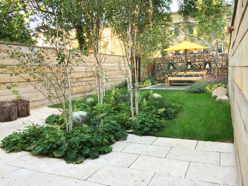 Small contemporary backyard partial sun garden in New York with brick pavers.