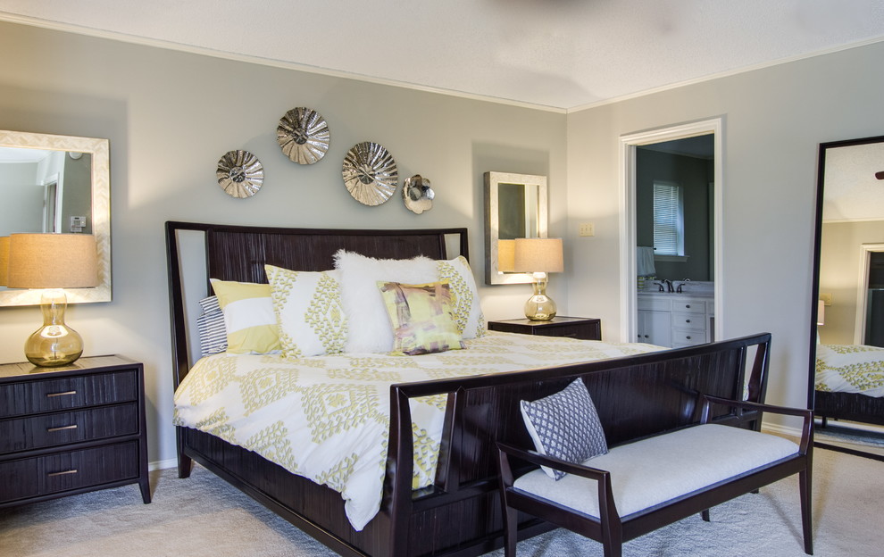 This is an example of a mid-sized contemporary master bedroom in Dallas with grey walls and carpet.