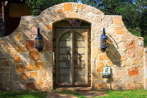 This is an example of a mediterranean entryway in Austin.