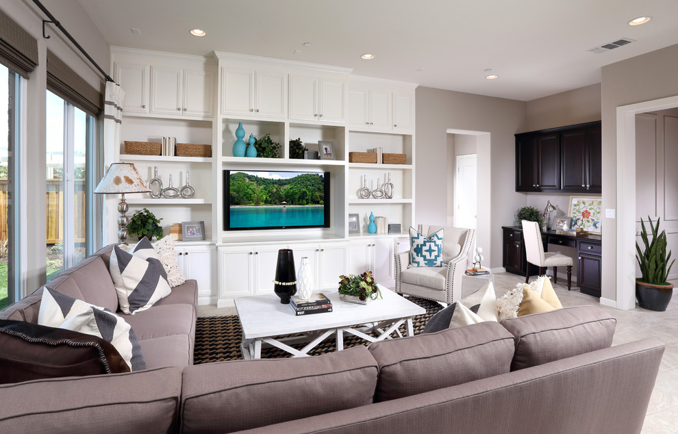 This is an example of a beach style family room in San Francisco with grey walls, no fireplace and a built-in media wall.