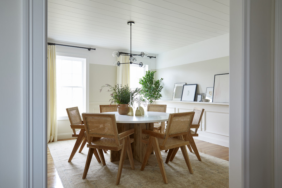 Inspiration for a mid-sized modern separate dining room in Bridgeport with white walls, medium hardwood floors and brown floor.