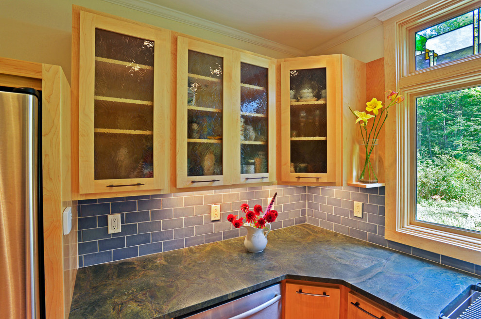 Kitchen - eclectic u-shaped medium tone wood floor kitchen idea in Boston with an undermount sink, glass-front cabinets, light wood cabinets, granite countertops, blue backsplash, ceramic backsplash, stainless steel appliances, no island and green countertops