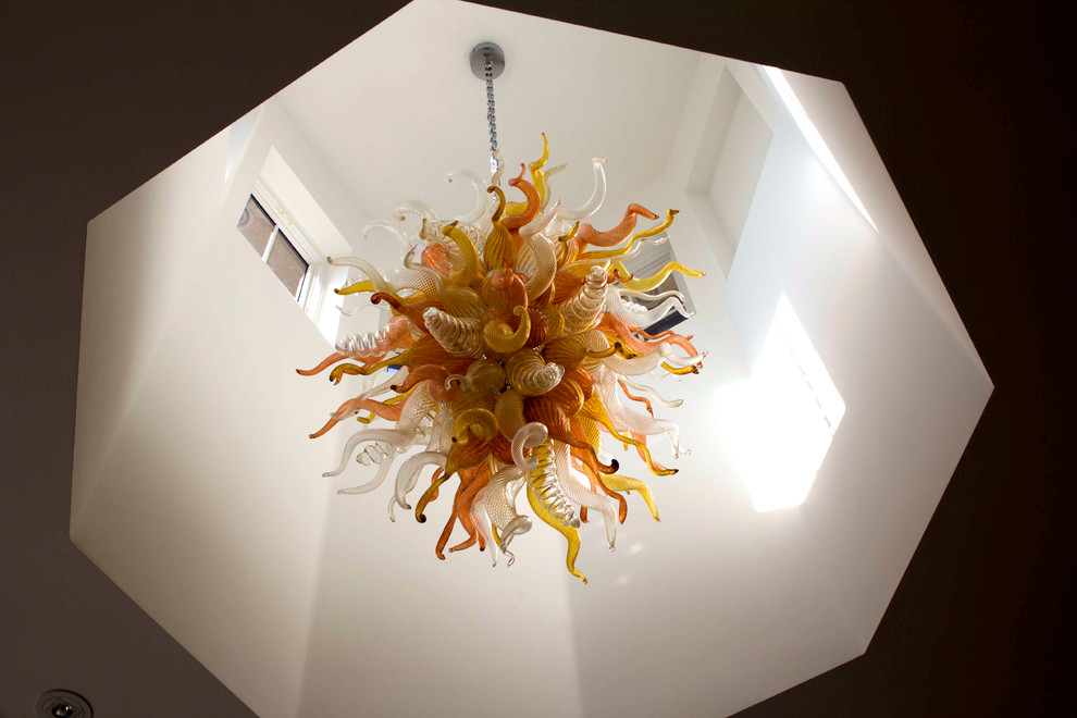 Example of a mid-sized transitional foyer design in DC Metro with white walls