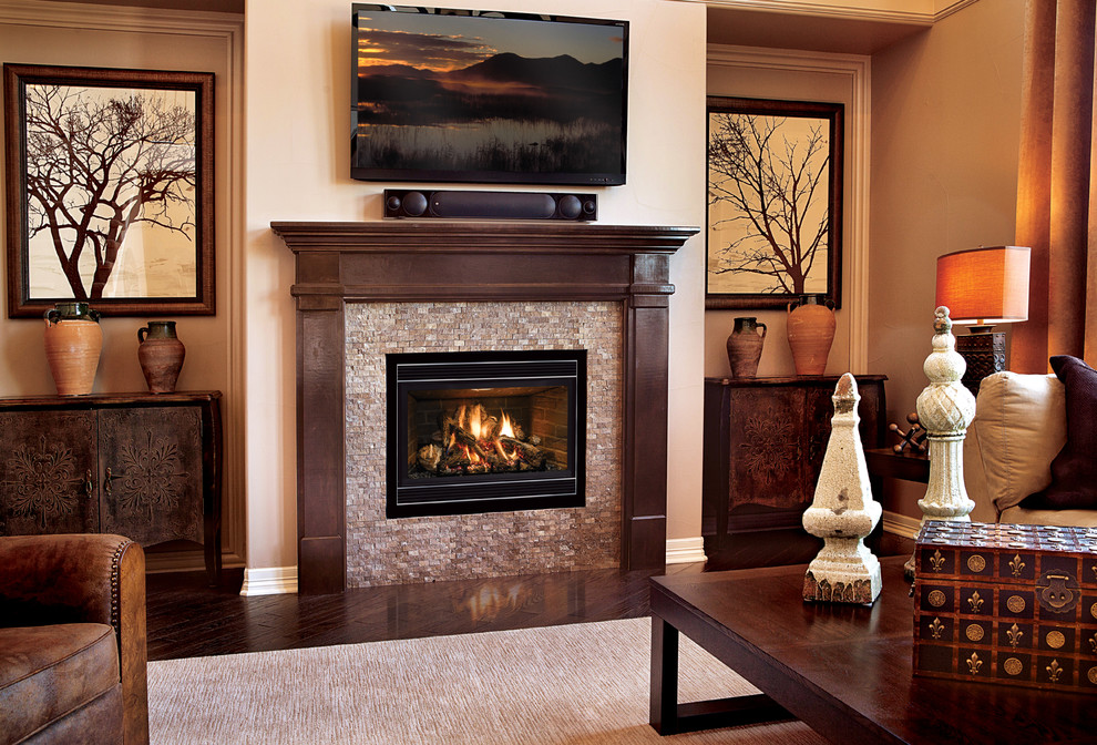 This is an example of a mid-sized traditional formal enclosed living room in Cedar Rapids with beige walls, dark hardwood floors, a standard fireplace, a tile fireplace surround, a wall-mounted tv and brown floor.
