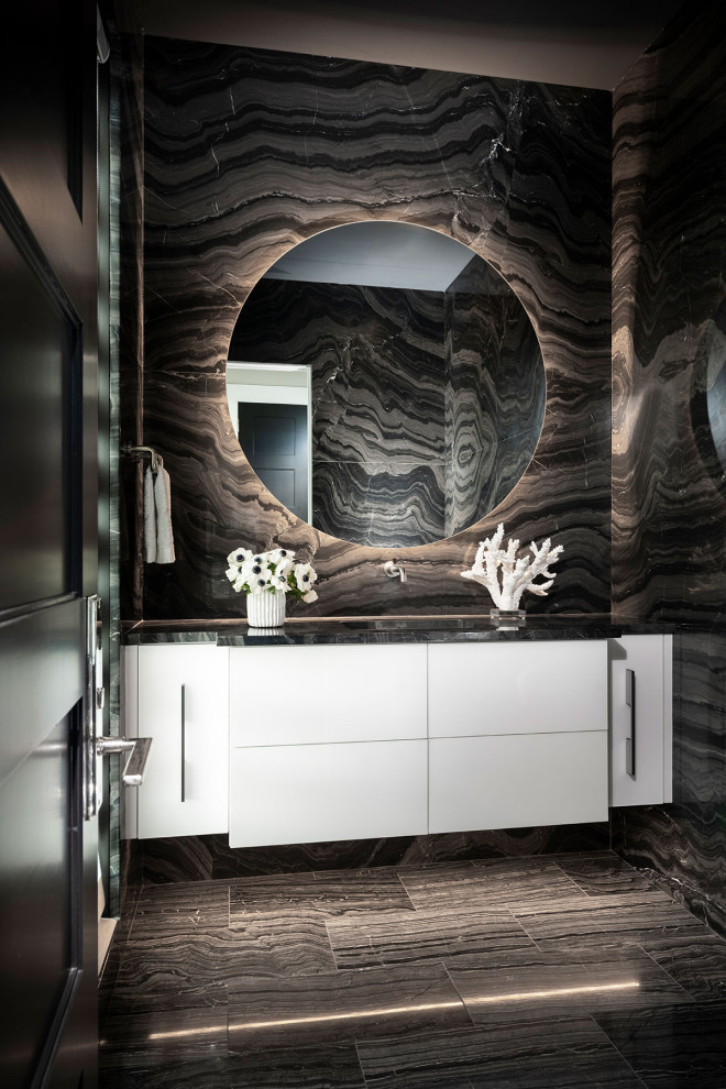 Design ideas for a large modern powder room in Other with flat-panel cabinets, white cabinets, a bidet, black tile, marble, black walls, marble floors, an undermount sink, marble benchtops, black floor, black benchtops and a floating vanity.