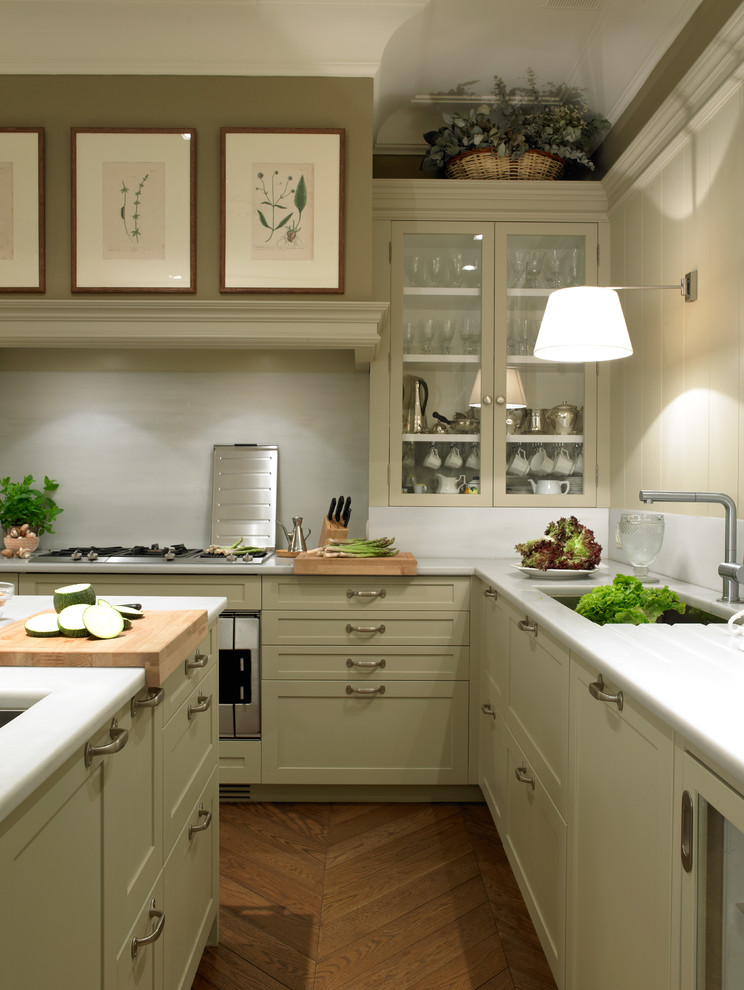 Inspiration for a mid-sized transitional l-shaped separate kitchen in Barcelona with an undermount sink, recessed-panel cabinets, beige cabinets, marble benchtops, white splashback, stone slab splashback, stainless steel appliances, medium hardwood floors and with island.