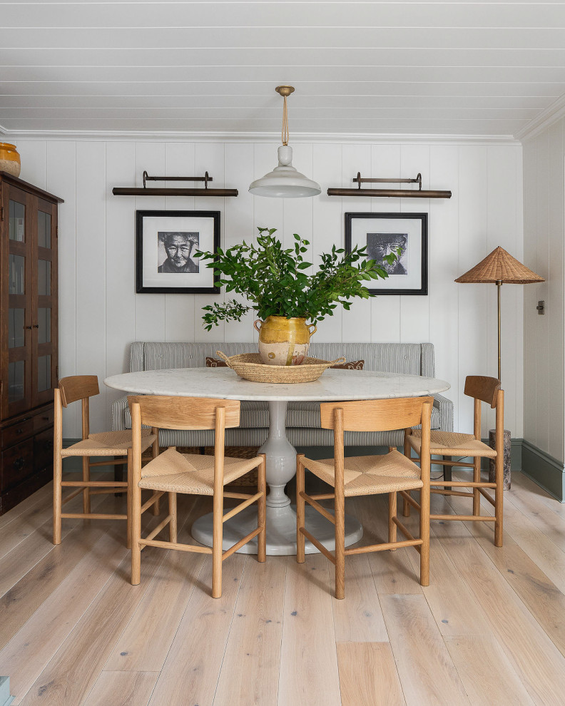 Design ideas for a transitional dining room in London with white walls, light hardwood floors, beige floor, timber and planked wall panelling.