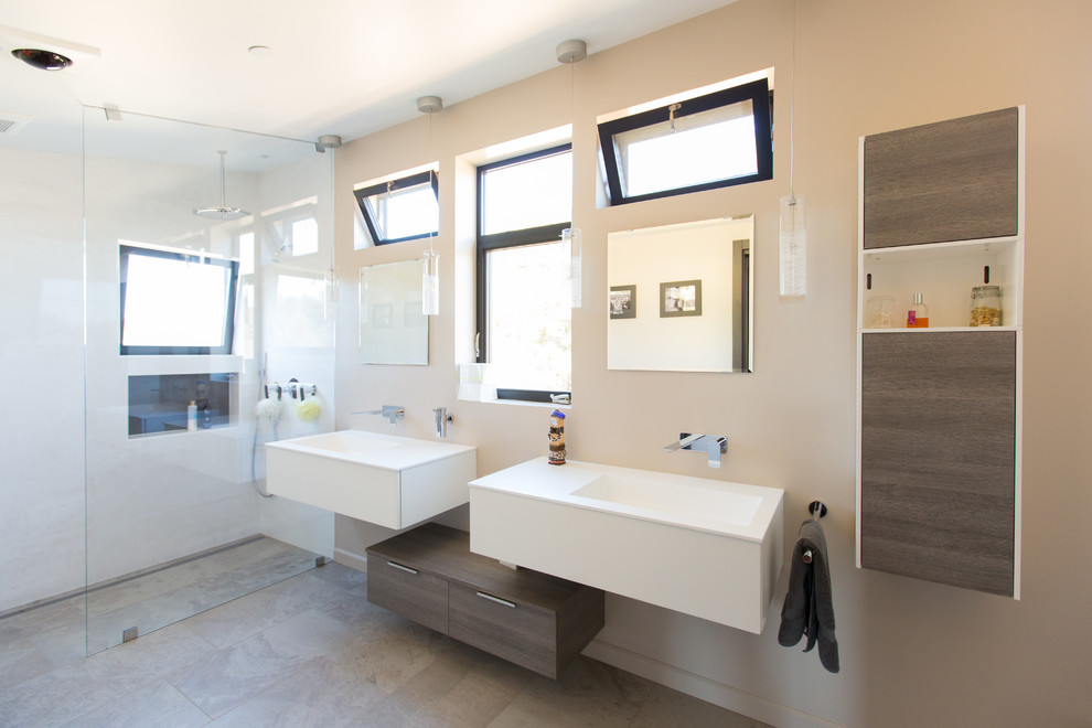 This is an example of a large contemporary bathroom in San Francisco with flat-panel cabinets, medium wood cabinets and a curbless shower.