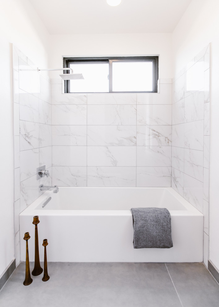 Design ideas for a mid-sized scandinavian kids bathroom in Other with flat-panel cabinets, white cabinets, an alcove tub, an alcove shower, a one-piece toilet, white tile, porcelain tile, white walls, porcelain floors, an undermount sink, engineered quartz benchtops, grey floor, a shower curtain and white benchtops.