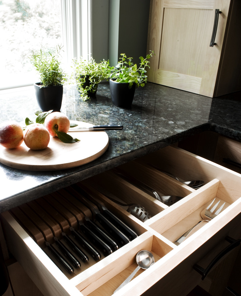 Example of a small transitional u-shaped eat-in kitchen design in Burlington with shaker cabinets, light wood cabinets, granite countertops, stainless steel appliances and an island