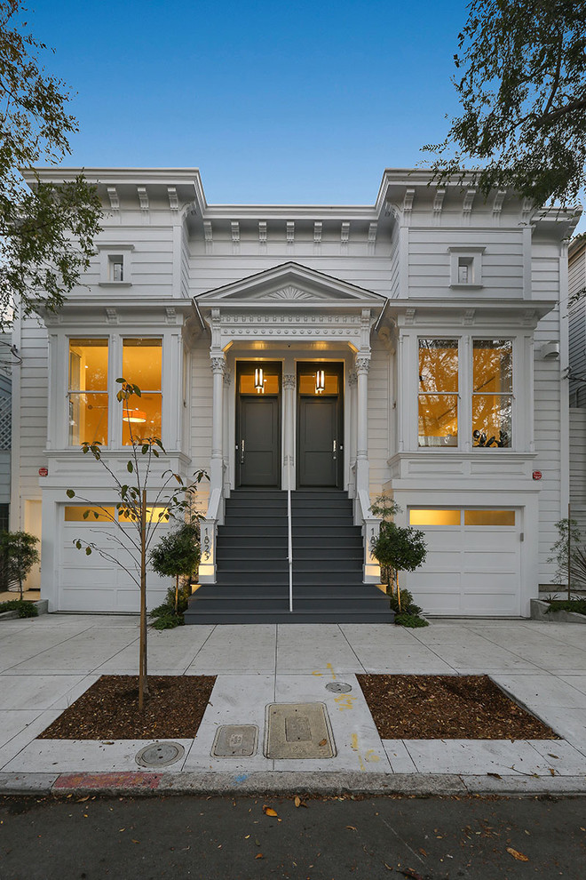 Design ideas for a traditional white duplex exterior in San Francisco with wood siding.