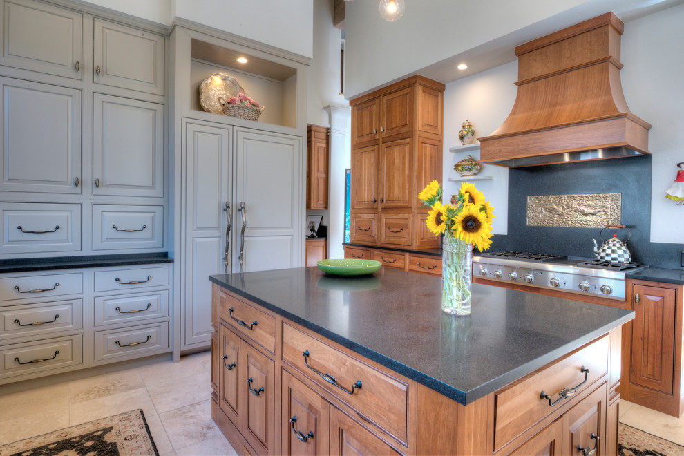 Mid-sized mountain style u-shaped travertine floor enclosed kitchen photo in Denver with beaded inset cabinets, light wood cabinets, quartz countertops, beige backsplash, stone slab backsplash, paneled appliances and an island