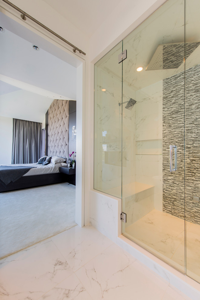 Design ideas for a contemporary bathroom in Vancouver with an open shower and marble floors.