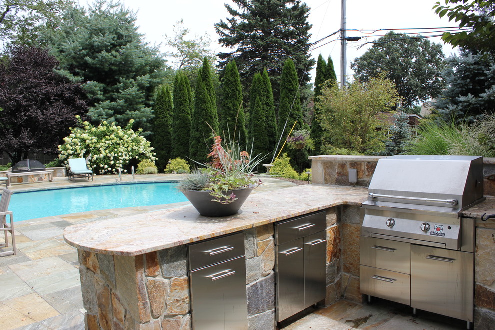 Photo of a transitional patio in Bridgeport with an outdoor kitchen.