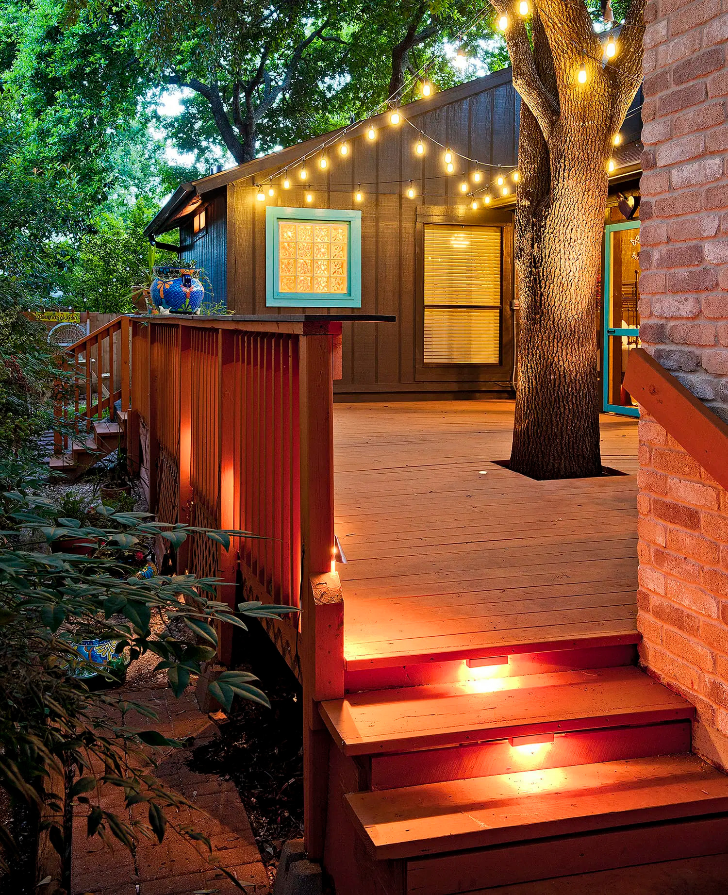 Modern composite deck design with outdoor lighting in Ottawa by Blue Crown Renovations.