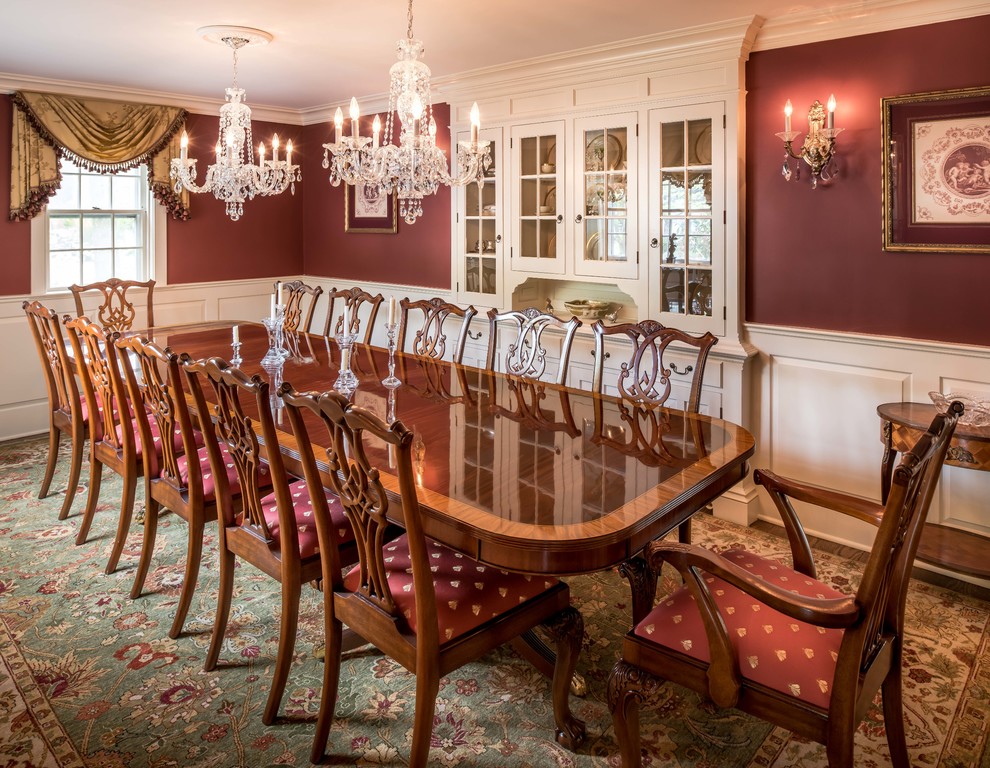 This is an example of a mid-sized traditional separate dining room in Philadelphia with red walls and dark hardwood floors.