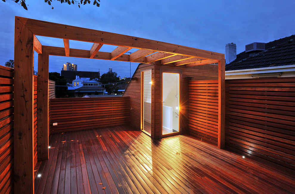 Photo of a mid-sized contemporary rooftop deck in Melbourne with a pergola.