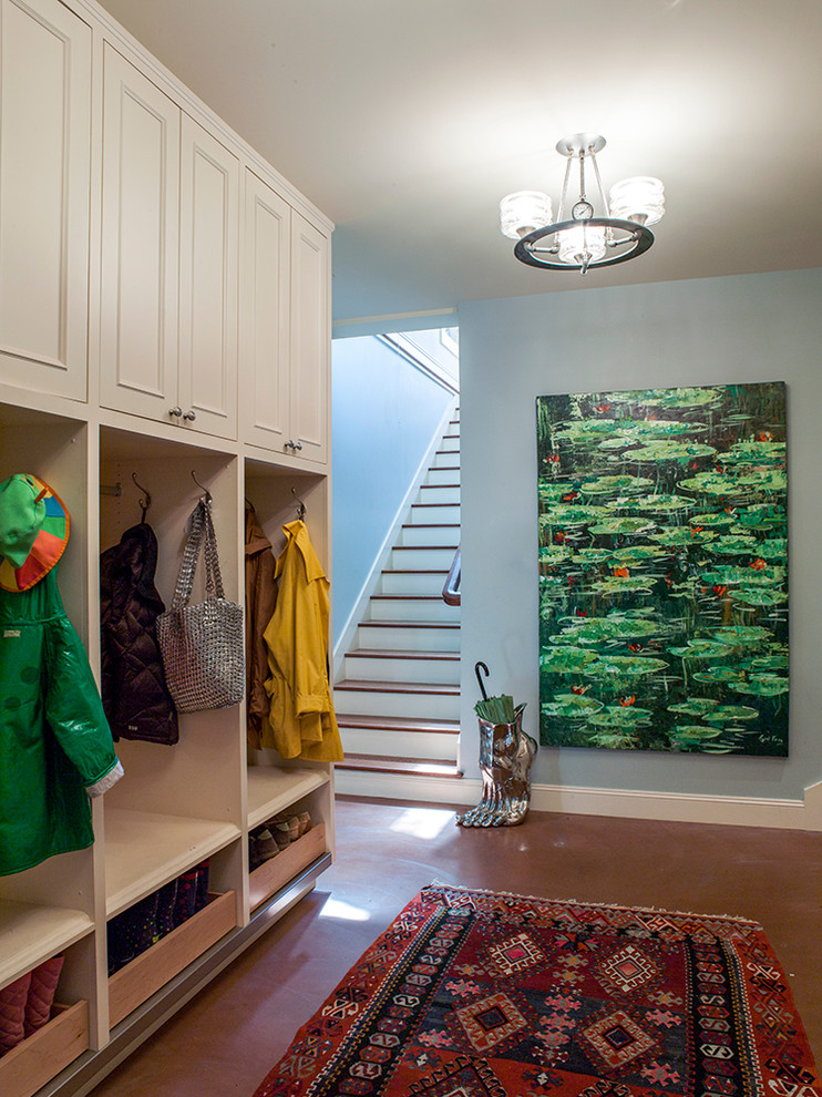 Design ideas for a mid-sized transitional mudroom in San Francisco with blue walls and concrete floors.