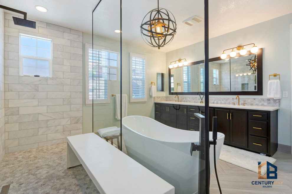 This is an example of a modern ensuite bathroom in San Francisco with raised-panel cabinets, dark wood cabinets, a freestanding bath, a walk-in shower, multi-coloured tiles, marble tiles, porcelain flooring, a submerged sink, an open shower, white worktops, double sinks and a built in vanity unit.