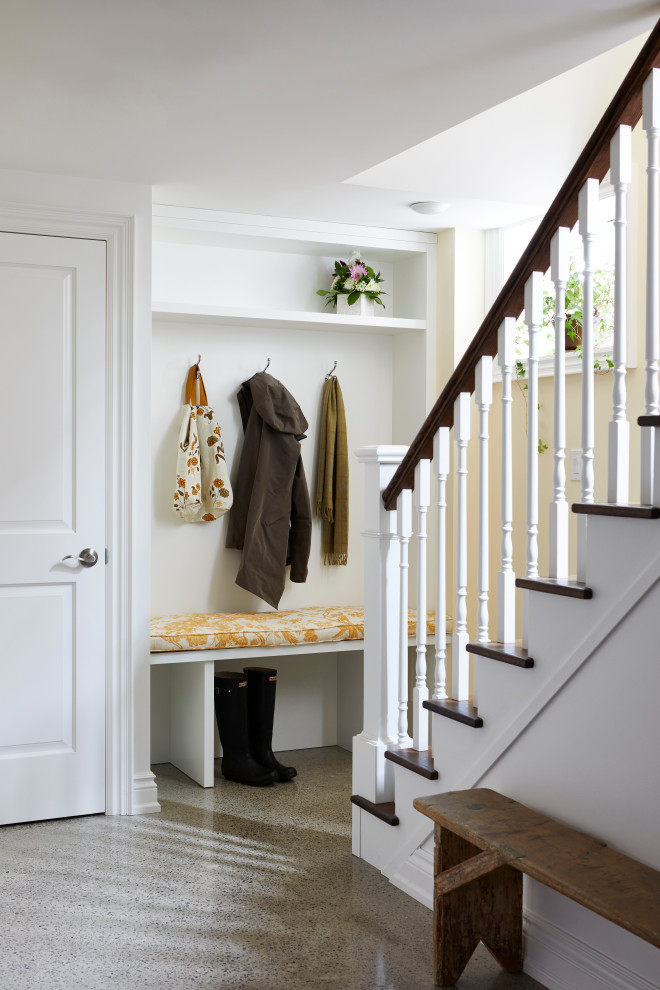 Mudroom - mid-sized traditional concrete floor and gray floor mudroom idea in Toronto with white walls