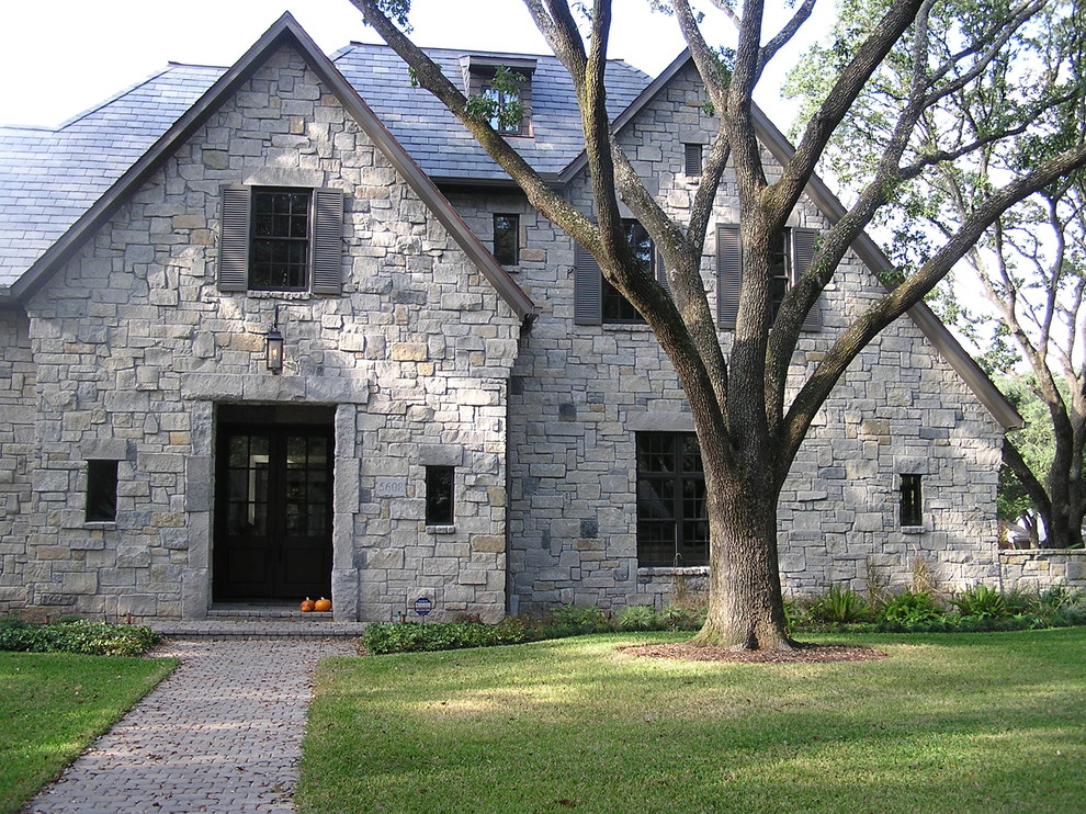 Design ideas for a traditional exterior in Houston with stone veneer.