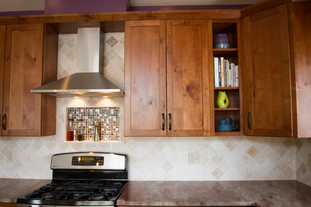 Open concept kitchen - large craftsman l-shaped ceramic tile and beige floor open concept kitchen idea in Denver with an undermount sink, shaker cabinets, medium tone wood cabinets, granite countertops, beige backsplash, ceramic backsplash, stainless steel appliances and an island