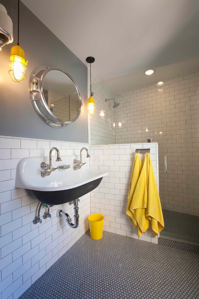 This is an example of a beach style bathroom in Orange County with subway tile.