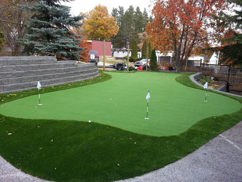 Design ideas for a large transitional backyard outdoor basketball/tennis/multi-game court in Edmonton.