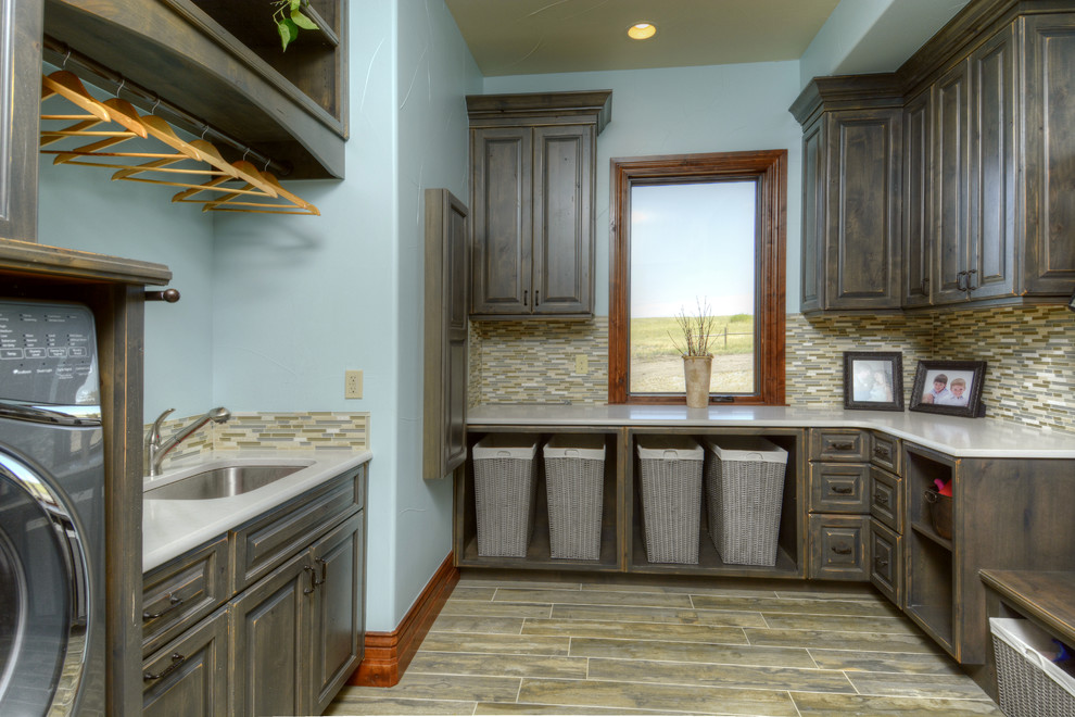 Inspiration for a large transitional u-shaped dedicated laundry room in Denver with raised-panel cabinets, distressed cabinets, blue walls and a side-by-side washer and dryer.