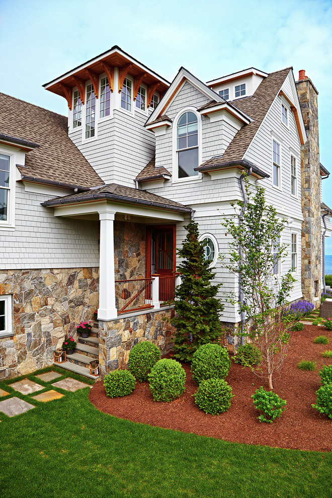 Inspiration for a large coastal gray three-story mixed siding exterior home remodel in New York