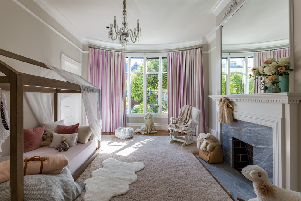 Little girl's bedroom - Example of a classic kids' room design in San Francisco