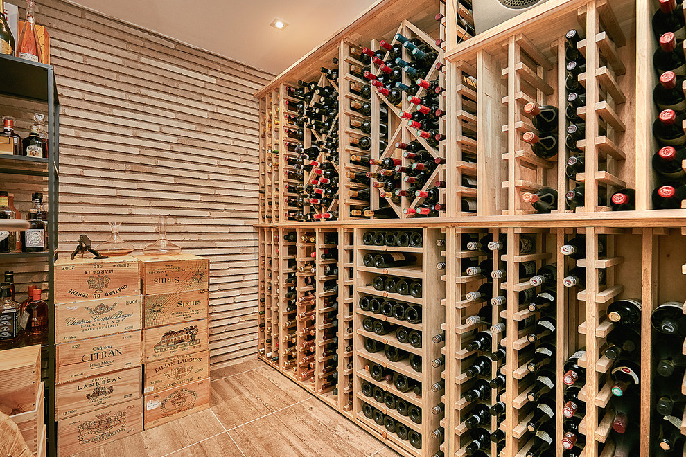 Design ideas for a contemporary wine cellar in Copenhagen with travertine floors and beige floor.