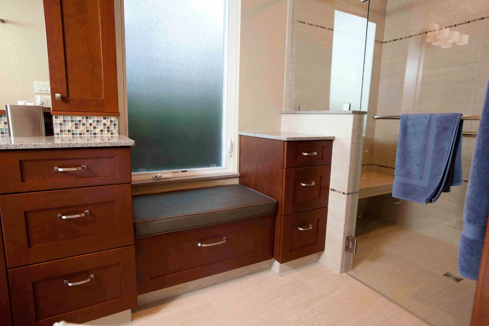 Inspiration for a mid-sized transitional master brown tile and ceramic tile porcelain tile freestanding bathtub remodel in Seattle with recessed-panel cabinets, medium tone wood cabinets, granite countertops, a two-piece toilet and gray walls