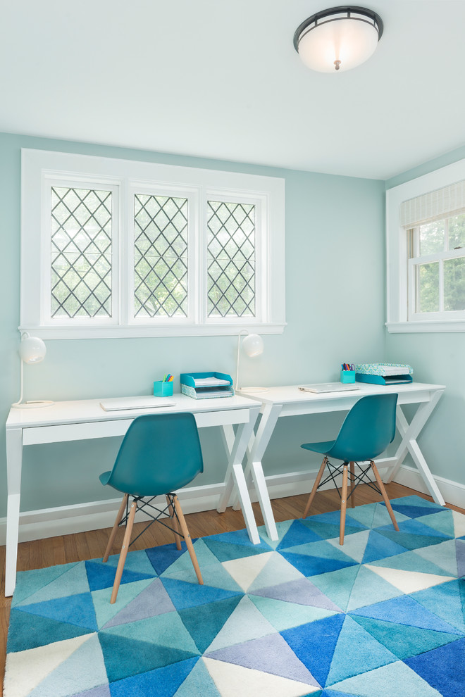 Design ideas for a transitional gender-neutral kids' study room in Boston with blue walls and medium hardwood floors.