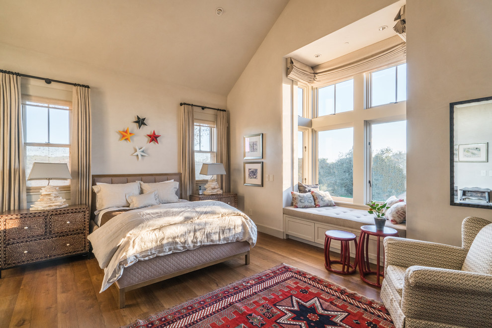 This is an example of a mid-sized country guest bedroom in San Francisco with beige walls, carpet and no fireplace.