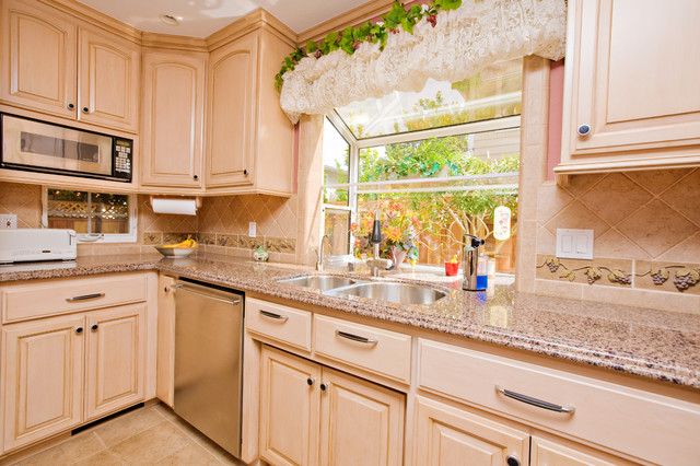 Wine Themed Kitchen With Wine Cooler And Grape Tile Details