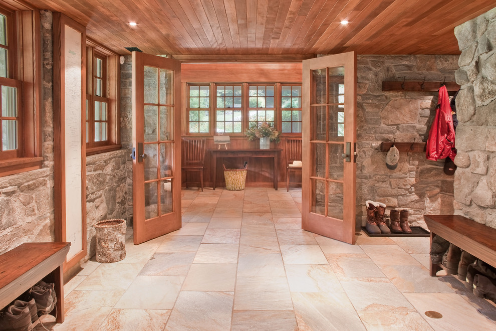 Inspiration for a country mudroom in Boston with slate floors.