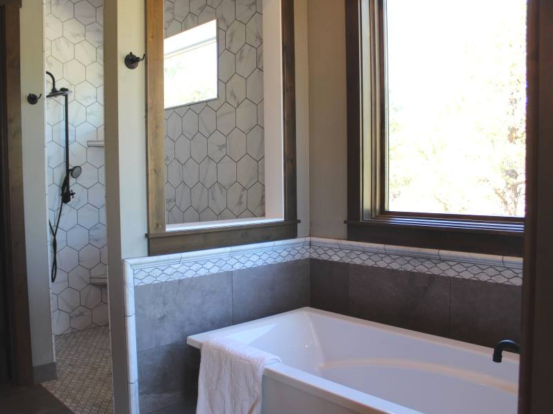 Photo of a mid-sized transitional master bathroom in Other with an alcove tub, an alcove shower, a one-piece toilet, white tile, marble and an open shower.