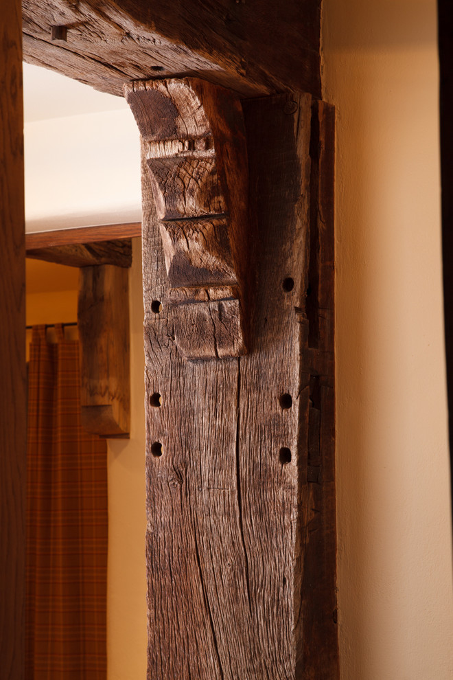 Inspiration for a mid-sized rustic hallway remodel with beige walls
