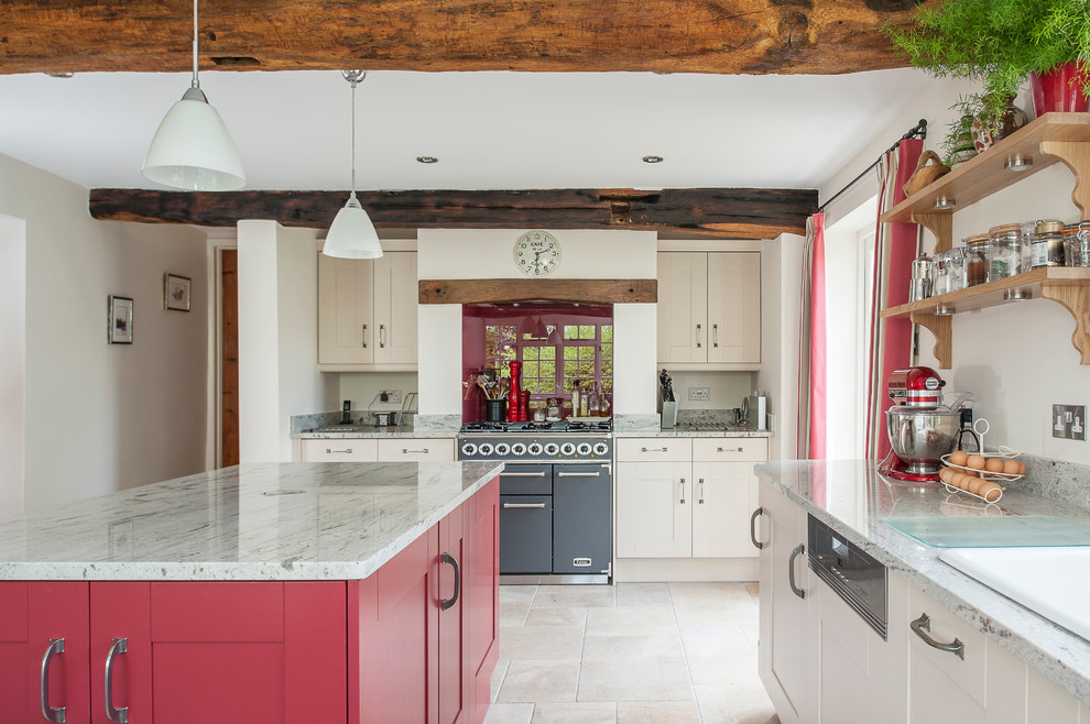 Inspiration for a large country eat-in kitchen in Kent with a double-bowl sink, red cabinets, granite benchtops, red splashback, panelled appliances, porcelain floors, with island, shaker cabinets and glass sheet splashback.