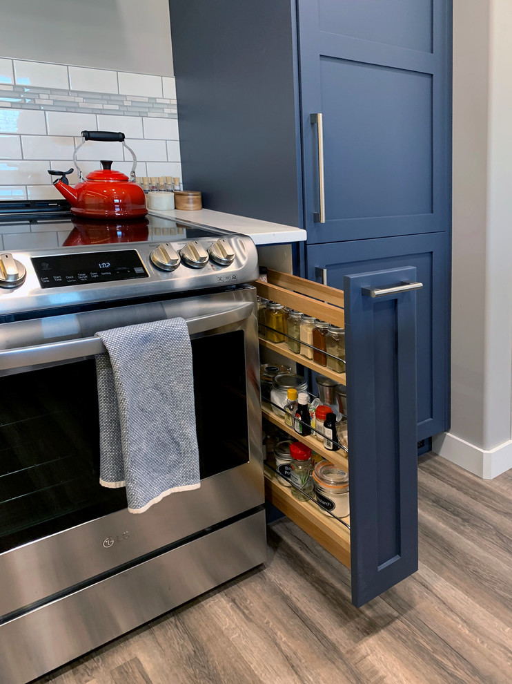 Example of a transitional kitchen design in Calgary