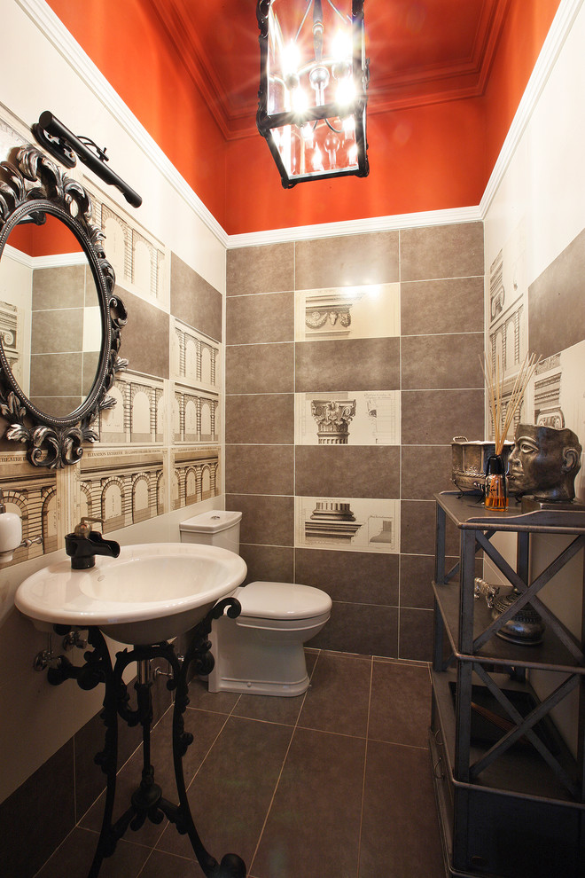 Eclectic powder room in Moscow with a pedestal sink, brown tile, multi-coloured walls and brown floor.
