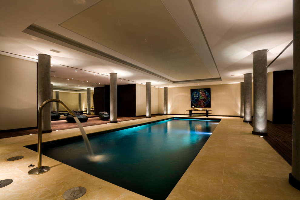 Mid-sized contemporary indoor rectangular pool in Malaga with a pool house.