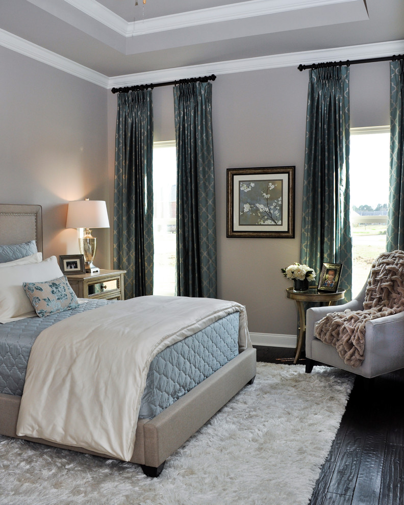 Mid-sized transitional master bedroom in Orlando with beige walls and dark hardwood floors.