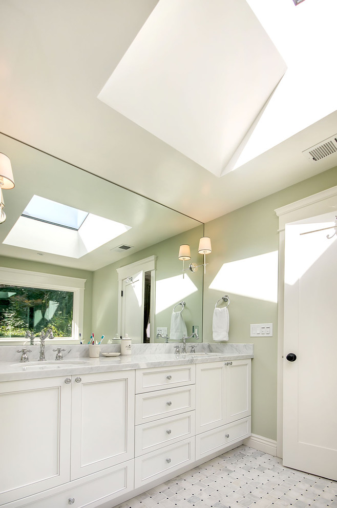 Photo of an arts and crafts bathroom in San Francisco with recessed-panel cabinets and white cabinets.